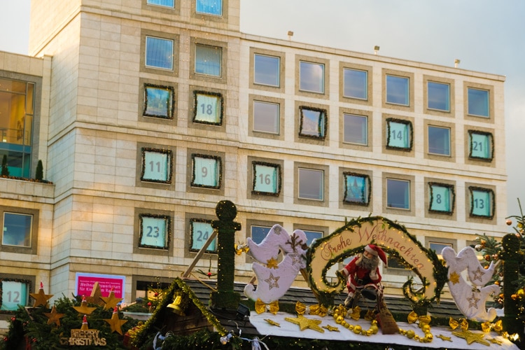 City hall with advent calendar and Christmas market