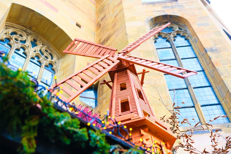 elaborate windmill decoration on top of Christmas booth