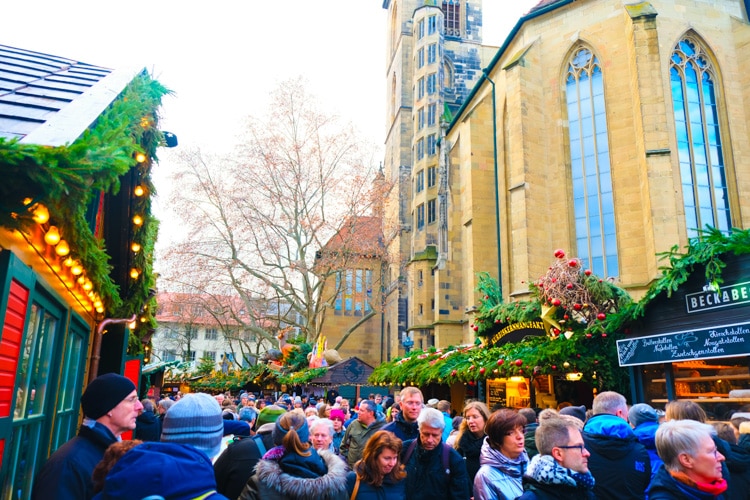 busy Christmas market next to church