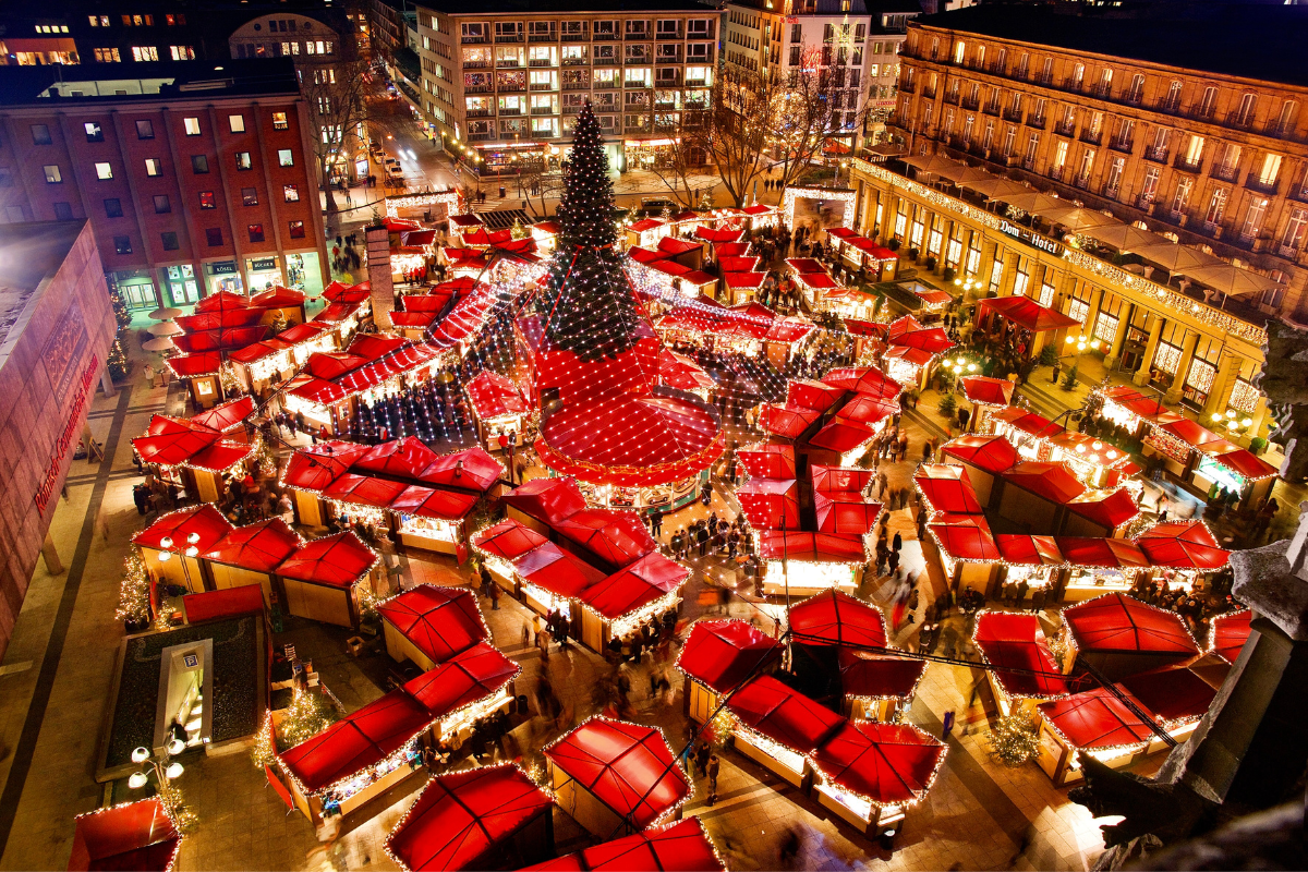 bright Christmas market stalls with red roofs