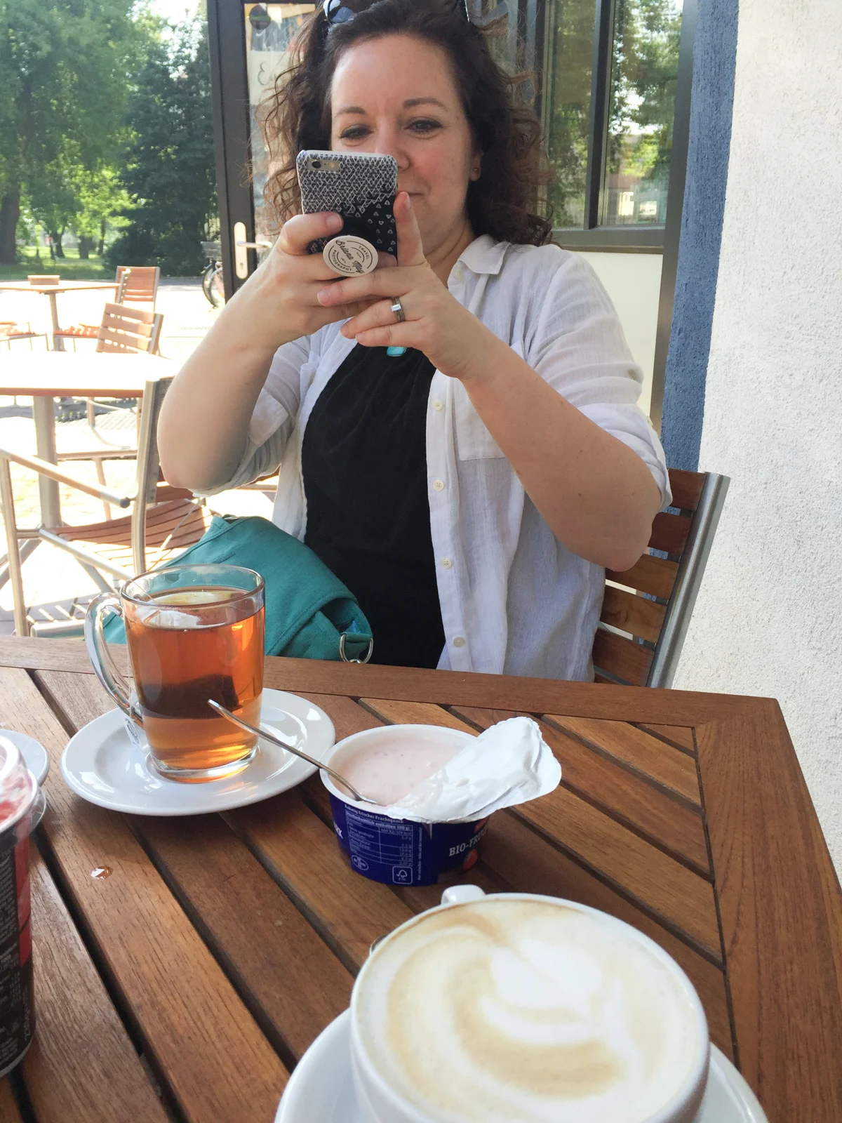 Cate taking photo of breakfast