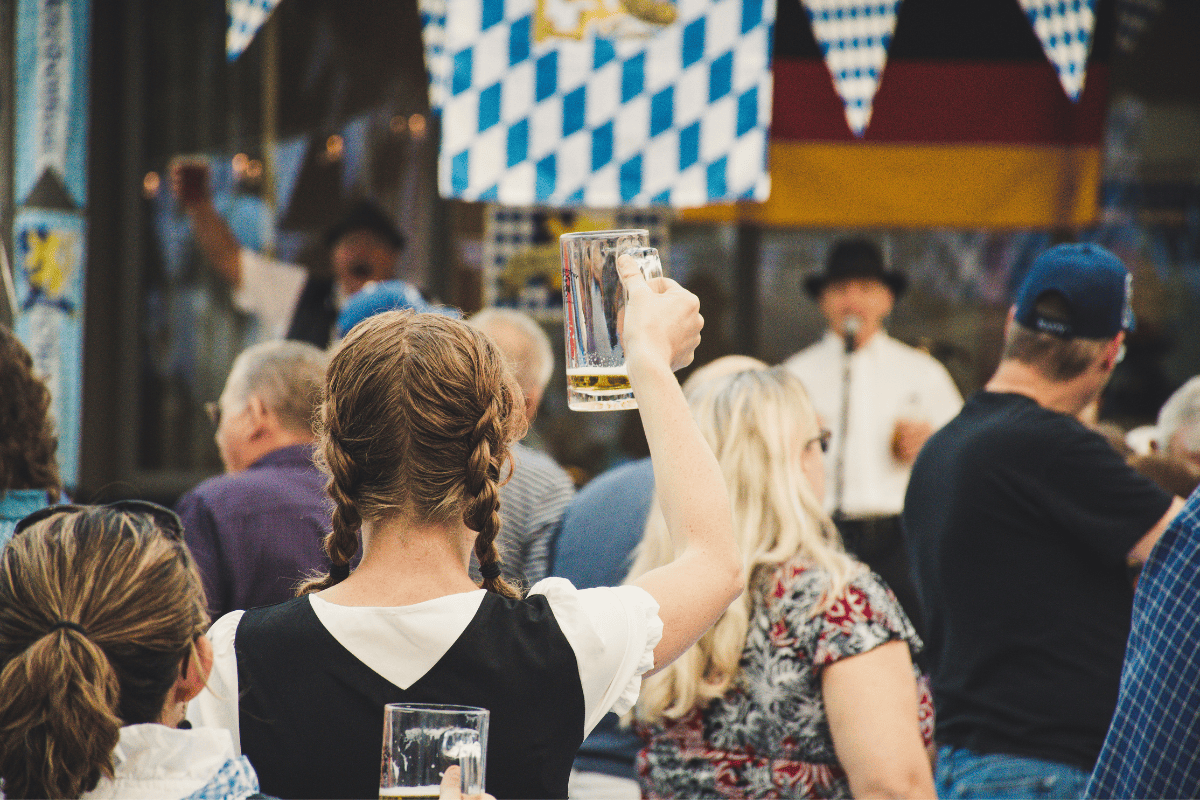 woman with raised beer glass at Oktoberfest 