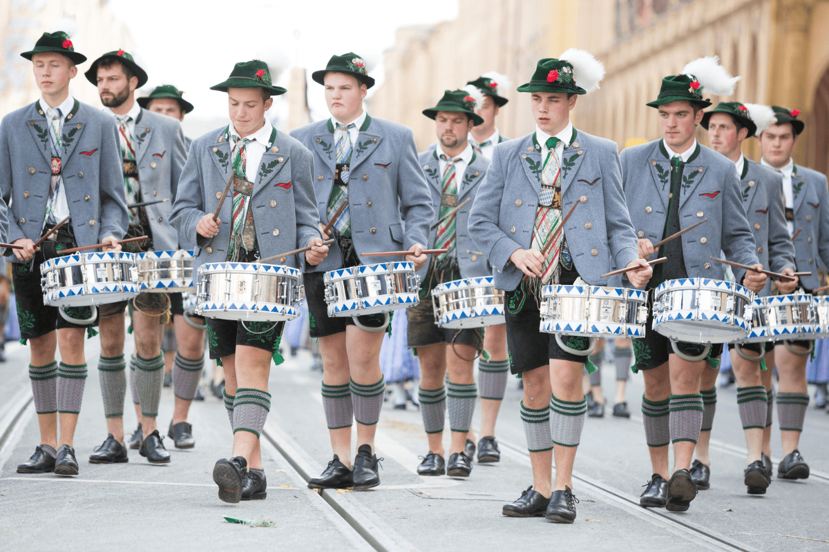 drummers wearing traditional clothing parade at Oktoberfest 