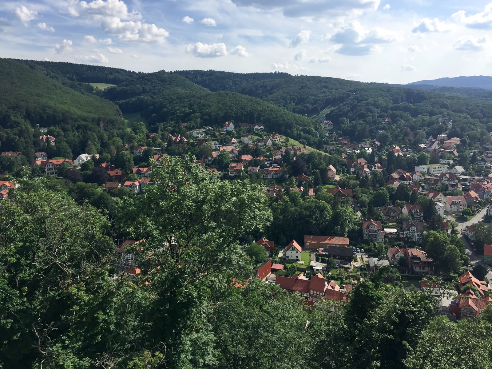 town and green rolling hills