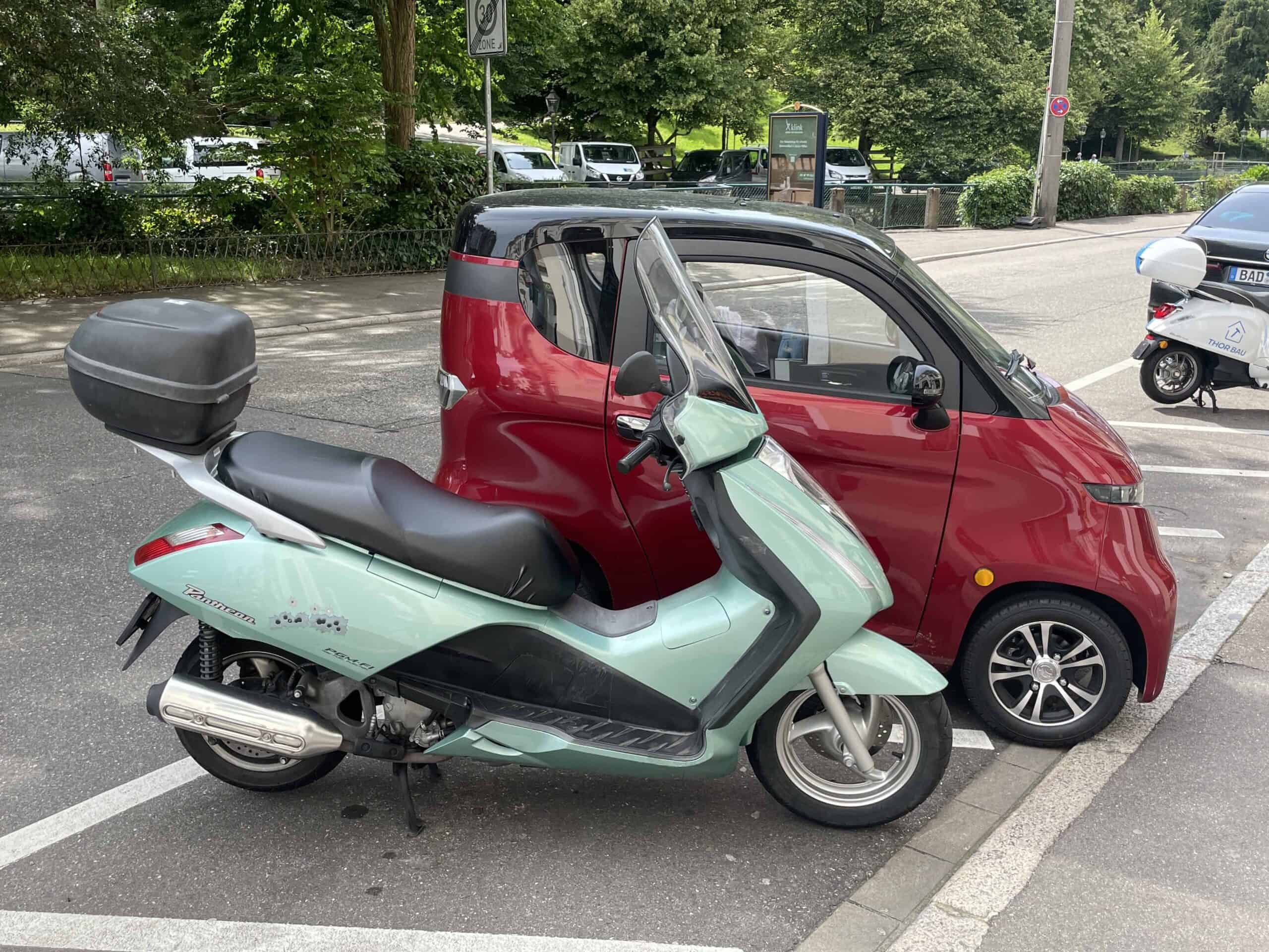 scooter and small car